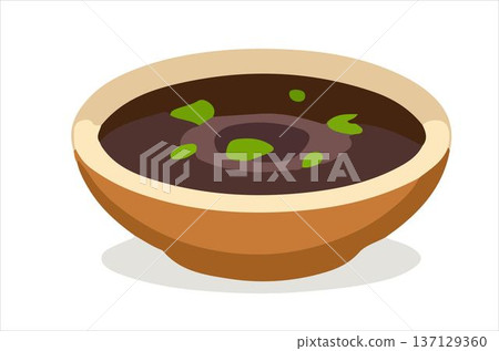 A vibrant bowl of black bean soup garnished with herbs. 137129360