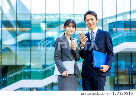Business people standing in an office building 137129519