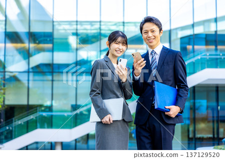 Business people standing in an office building 137129520