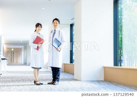 Men and women in white 137129540