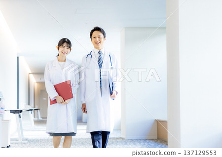 Men and women in white 137129553