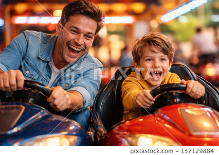 Father and son enjoying bumper cars at amusement park on exciting day. concept of family fun, joyful experience, thrilling entertainment 137129884