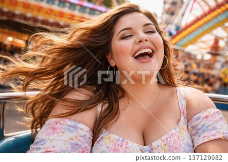Young plus size woman enjoying a thrilling ride at an amusement park with a background of colorful attractions. concept of happiness, excitement, outdoor fun. 137129982
