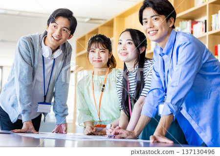 Male and female office workers having a meeting Male and female office workers having a meeting 137130496