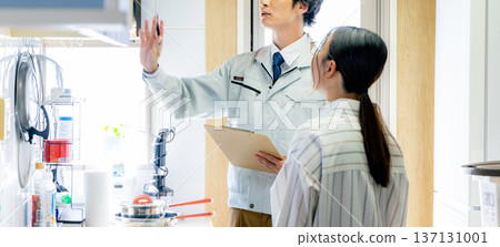Male worker inspecting the kitchen Male worker inspecting the kitchen 137131001