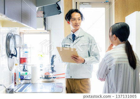 Male worker inspecting the kitchen 137131005