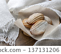 Delicious madeleine pastries presented on a rustic table. Classic French treats 137131206