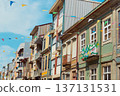 Festive bunting and lanterns decorate a narrow street for summer festival in June San Juan 137131531