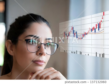 A woman thinking while looking at stock prices A woman thinking while looking at stock prices 137132060