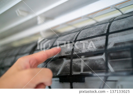 Rub the dust on the air conditioner filter with your finger Rub the dust on the air conditioner filter with your finger 137133025