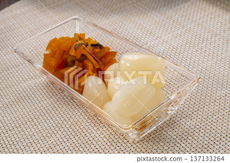 Fresh pickled radishes. Traditional Japanese pickles. Image of preserved food and healthy food. Fresh pickled radishes. Traditional Japanese pickles. Image of preserved food and healthy food. 137133264