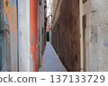 A very narrow alleyway between old buildings 137133729