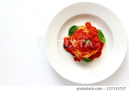 Tomato pasta on a white background viewed from directly above Tomato pasta on a white background viewed from directly above 137133737