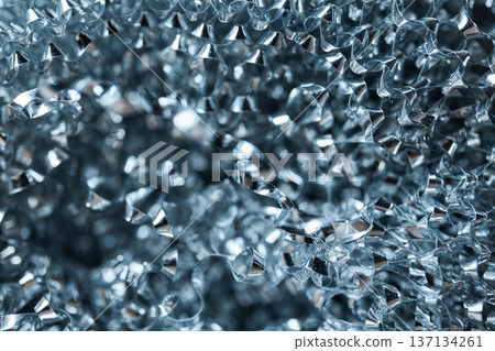Detailed macro view of silver metallic shavings and curled steel wool fibers with industrial highlights 137134261
