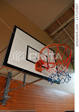 Basketball goal installed in an elementary school gymnasium Basketball goal installed in an elementary school gymnasium 137135807