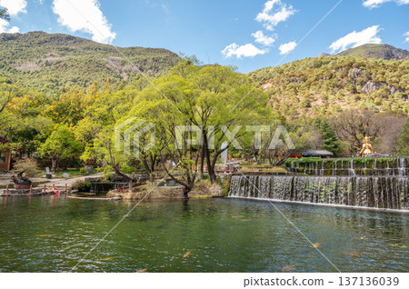 Tranquility view of Jade Water Village in Yunnan, China. Jade Water Village is a scenic spot where hypostatic union of Naxi culture and nature landscape, it was built in 1997. 137136039