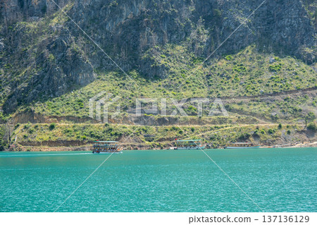 Panoramic Landscape view on green canyon Antalya Turkey with turquoise water mountain cliffs and green forest. Showcasing natural beauty travel tourist destination. Vacation concept Panoramic Landscape view on green canyon Antalya Turkey with turquoise water mountain cliffs and green forest. Showcasing natural beauty travel tourist destination. Vacation concept 137136129