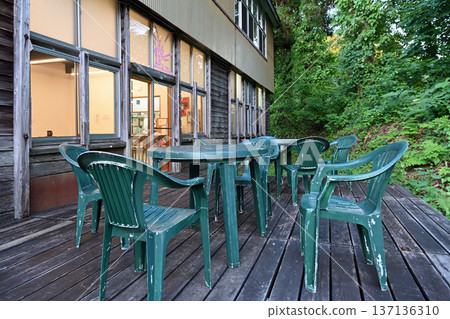 A wooden deck terrace at a repurposed school facility nestled in the lush green countryside of Tokamachi City, Niigata Prefecture A wooden deck terrace at a repurposed school facility nestled in the lush green countryside of Tokamachi City, Niigata Prefecture 137136310