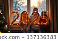 In a cozy room, the family poses by a big window showcasing a snowy view. Each member holds part of a luminous 2025 garland, celebrating the festive season 137136383
