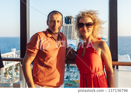 Couple in love on cruise ship. Man and woman in love enjoying their romantic vacation. High quality photo 137136796