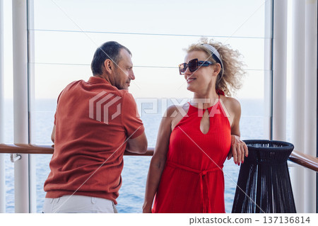Couple in love on cruise ship. Man and woman in love enjoying their romantic vacation. High quality photo Couple in love on cruise ship. Man and woman in love enjoying their romantic vacation. High quality photo 137136814
