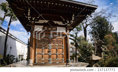 Myoo-do Hall and garden bathed in sunlight at a historic temple in Tokyo Myoo-do Hall and garden bathed in sunlight at a historic temple in Tokyo 137137771