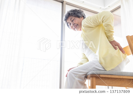 Senior women with low back pain Senior women with low back pain 137137809