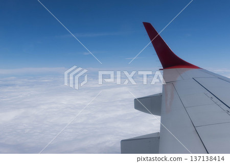 View from the plane wing and clouds, Italy View from the plane wing and clouds, Italy 137138414