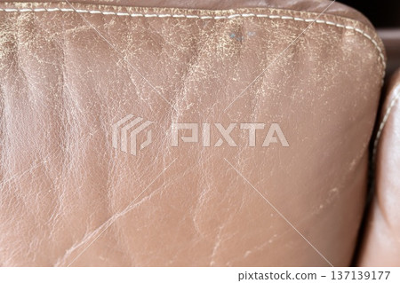 An old leather sofa that has worn off over time 137139177
