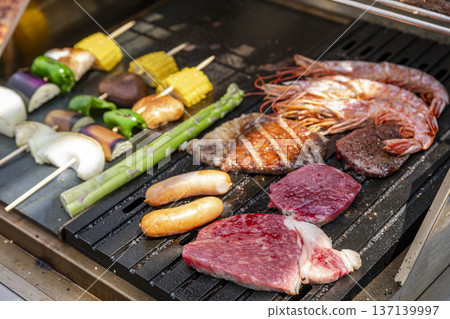 Delicious meat grilled on a barbecue grill 137139997