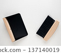 Mini tabletop broom and dustpan on white background 137140019