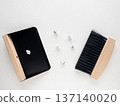 Mini tabletop broom and dustpan on white background 137140020