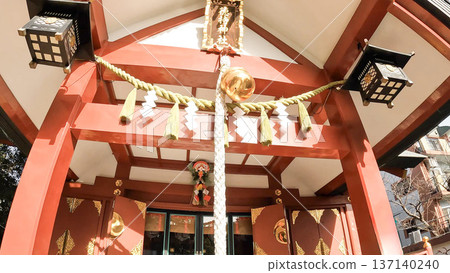 Tokumochi Shrine's main shrine and its bright vermilion torii gate and sacred rope Tokumochi Shrine's main shrine and its bright vermilion torii gate and sacred rope 137140240
