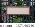 Large blank billboard on a street wall, banners with room to add your own text 137140340