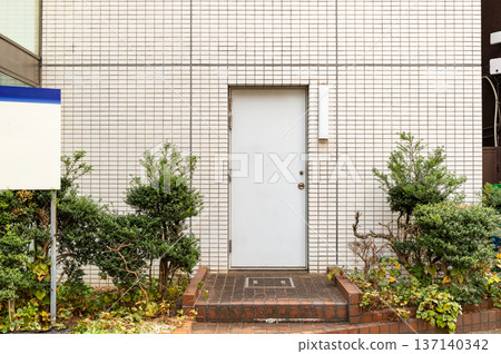 sidewalk by street wall and door sidewalk by street wall and door 137140342