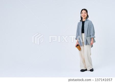 Young woman with a relaxed smile 137141057