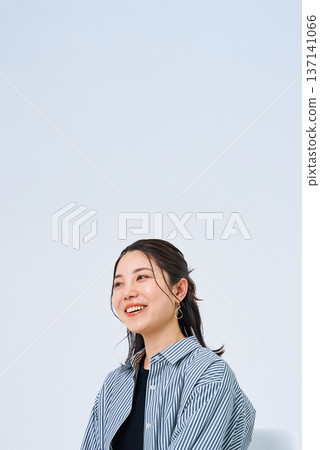 Young woman with a relaxed smile Young woman with a relaxed smile 137141066
