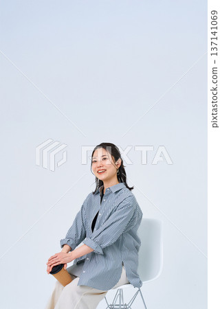 Young woman with a relaxed smile Young woman with a relaxed smile 137141069