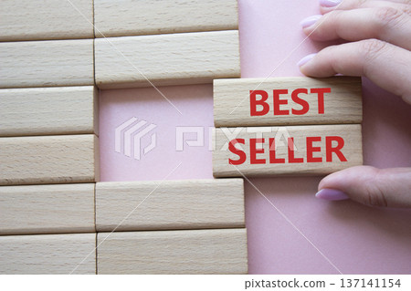 Back Taxes symbol. Concept word Back Taxes on wooden blocks. Businessman hand. Beautiful pink background. Business and Back Taxes concept. Copy space 137141154