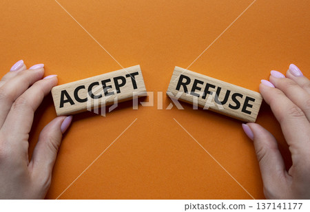 Accept or Reject symbol. Concept word Accept or Reject on wooden blocks. Businessman hand. Beautiful orange background. Business and Accept or Reject concept. Copy space Accept or Reject symbol. Concept word Accept or Reject on wooden blocks. Businessman hand. Beautiful orange background. Business and Accept or Reject concept. Copy space 137141177