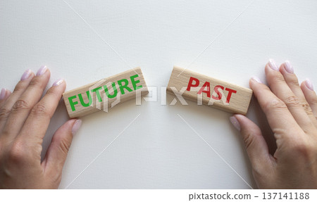 Future or Past symbol. Concept word Future or Past on wooden blocks. Businessman hand. Beautiful white background. Business and Future or Past concept. Copy space Future or Past symbol. Concept word Future or Past on wooden blocks. Businessman hand. Beautiful white background. Business and Future or Past concept. Copy space 137141188