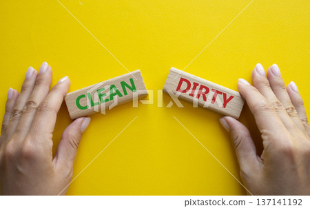 Clean or Dirty symbol. Concept word Clean or Dirty on wooden blocks. Man hand. Beautiful yellow background. Gender and Clean or Dirty concept. Copy space Clean or Dirty symbol. Concept word Clean or Dirty on wooden blocks. Man hand. Beautiful yellow background. Gender and Clean or Dirty concept. Copy space 137141192