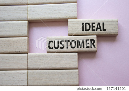 Ideal Customer symbol. Wooden blocks with words Ideal Customer. Beautiful pink background. Business and Ideal Customer concept. Copy space. Ideal Customer symbol. Wooden blocks with words Ideal Customer. Beautiful pink background. Business and Ideal Customer concept. Copy space. 137141201