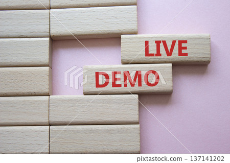 Live Demo symbol. Concept word Live Demo on wooden blocks. Beautiful pink background. Business and Live Demo concept. Copy space Live Demo symbol. Concept word Live Demo on wooden blocks. Beautiful pink background. Business and Live Demo concept. Copy space 137141202