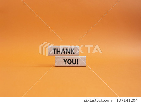Thank you symbol. Wooden blocks with words Thank you. Beautiful orange background. Business and Thank you concept. Copy space. Thank you symbol. Wooden blocks with words Thank you. Beautiful orange background. Business and Thank you concept. Copy space. 137141204