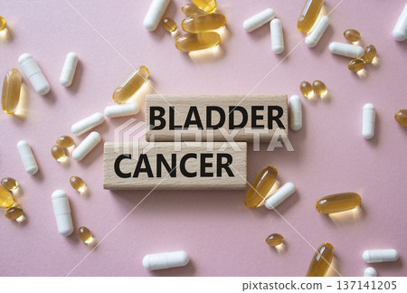 Bladder Cancer symbol. Concept word Bladder Cancer on wooden blocks. Beautiful pink background with pills. Medicine and Bladder Cancer concept. Copy space Bladder Cancer symbol. Concept word Bladder Cancer on wooden blocks. Beautiful pink background with pills. Medicine and Bladder Cancer concept. Copy space 137141205