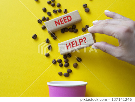 Need Help symbol. Concept word Need Help on wooden blocks. Beautiful yellow background with coffee cup. Businessman hand. Business and Need Help concept. Copy space Need Help symbol. Concept word Need Help on wooden blocks. Beautiful yellow background with coffee cup. Businessman hand. Business and Need Help concept. Copy space 137141246