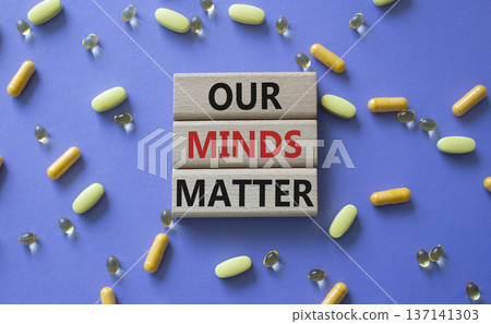 Our Minds Matter symbol. Concept words Our Minds Matter on wooden blocks. Beautiful purple background with pills. Healthcare and Our Minds Matter concept. Copy space. 137141303