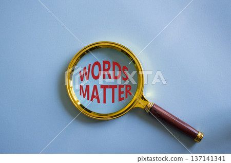 Words Matter symbol. Magnifying Glass with Concept word Words Matter. Beautiful blue background. Business and Words Matter concept. Copy space 137141341