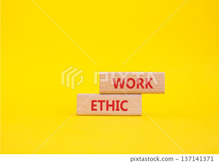 Work Ethic symbol. Concept words Work Ethic on wooden blocks. Beautiful yellow background. Business and Work Ethic concept. Copy space. 137141371